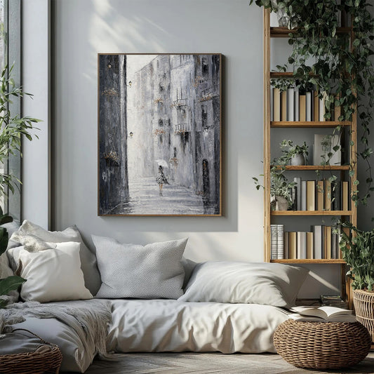 Cozy living room with a sofa, bookshelf, and wall art