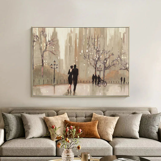 Room mockup showing couple walking among bare trees, lamps and distant figures in a soft beige and brown park scene.