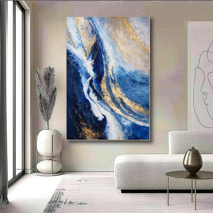 Modern living room with abstract blue and gold painting on the wall