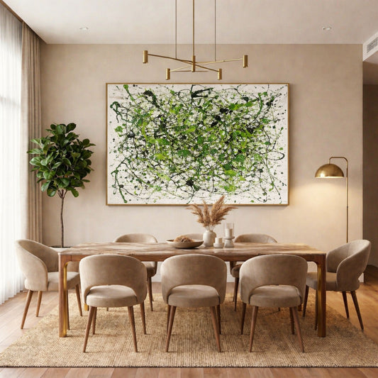 Green abstract drip painting displayed above dining table in warm contemporary interior
