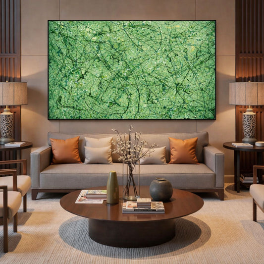 Green abstract drip artwork with black detailing framed above sofa in warm contemporary living room
