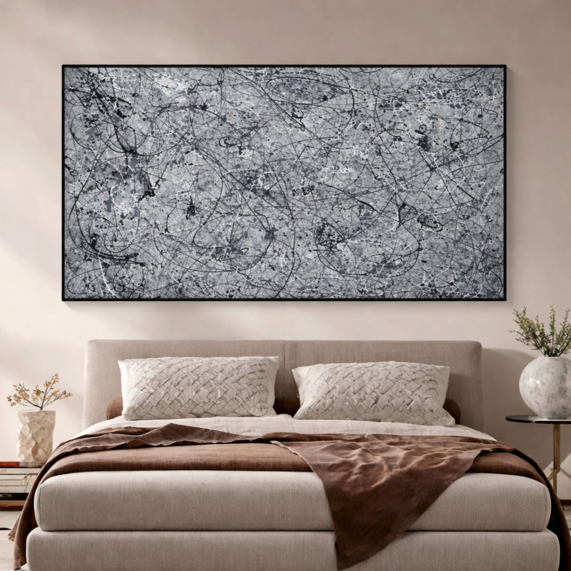 Grey abstract drip painting with black lines mounted above bed in minimalist bedroom interior