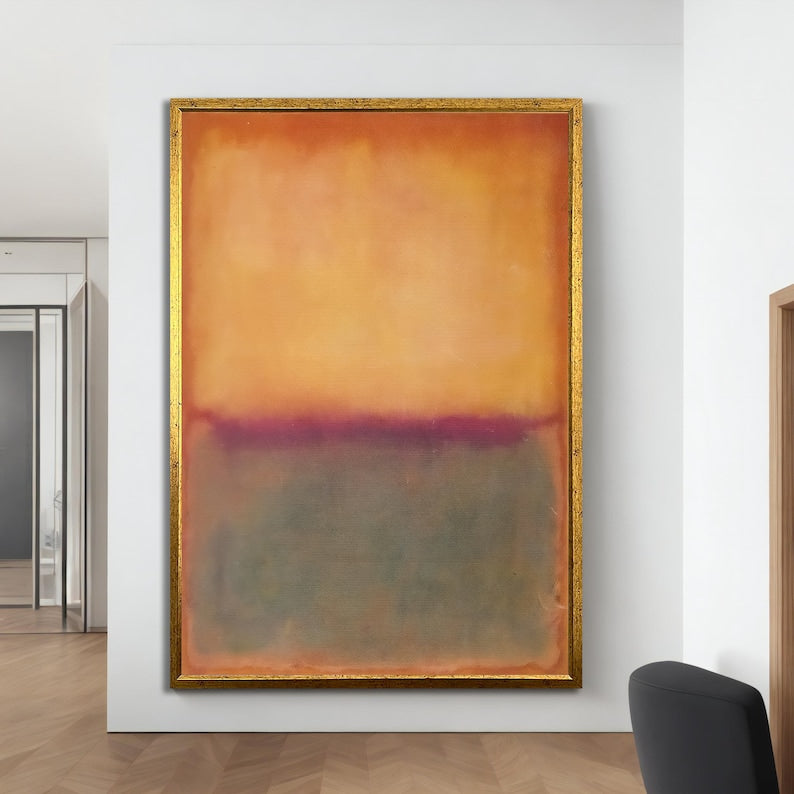 Abstract painting with a gold frame on a white wall
