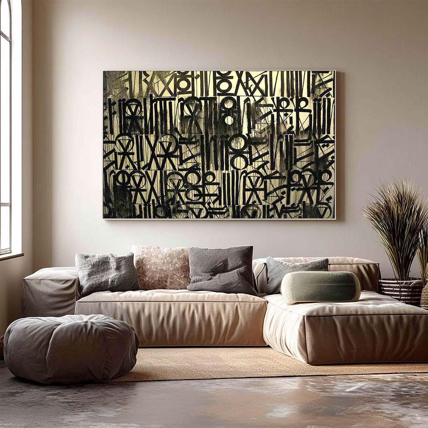 Abstract artwork on a wall above a beige sofa in a living room.