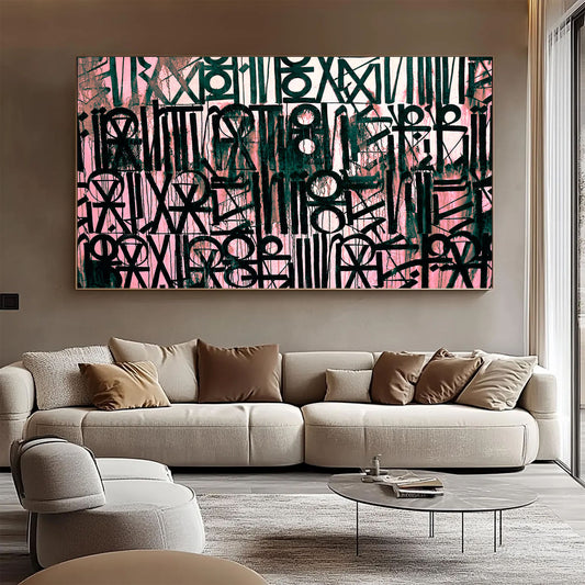 Abstract art painting in a modern living room with a sofa and coffee table.