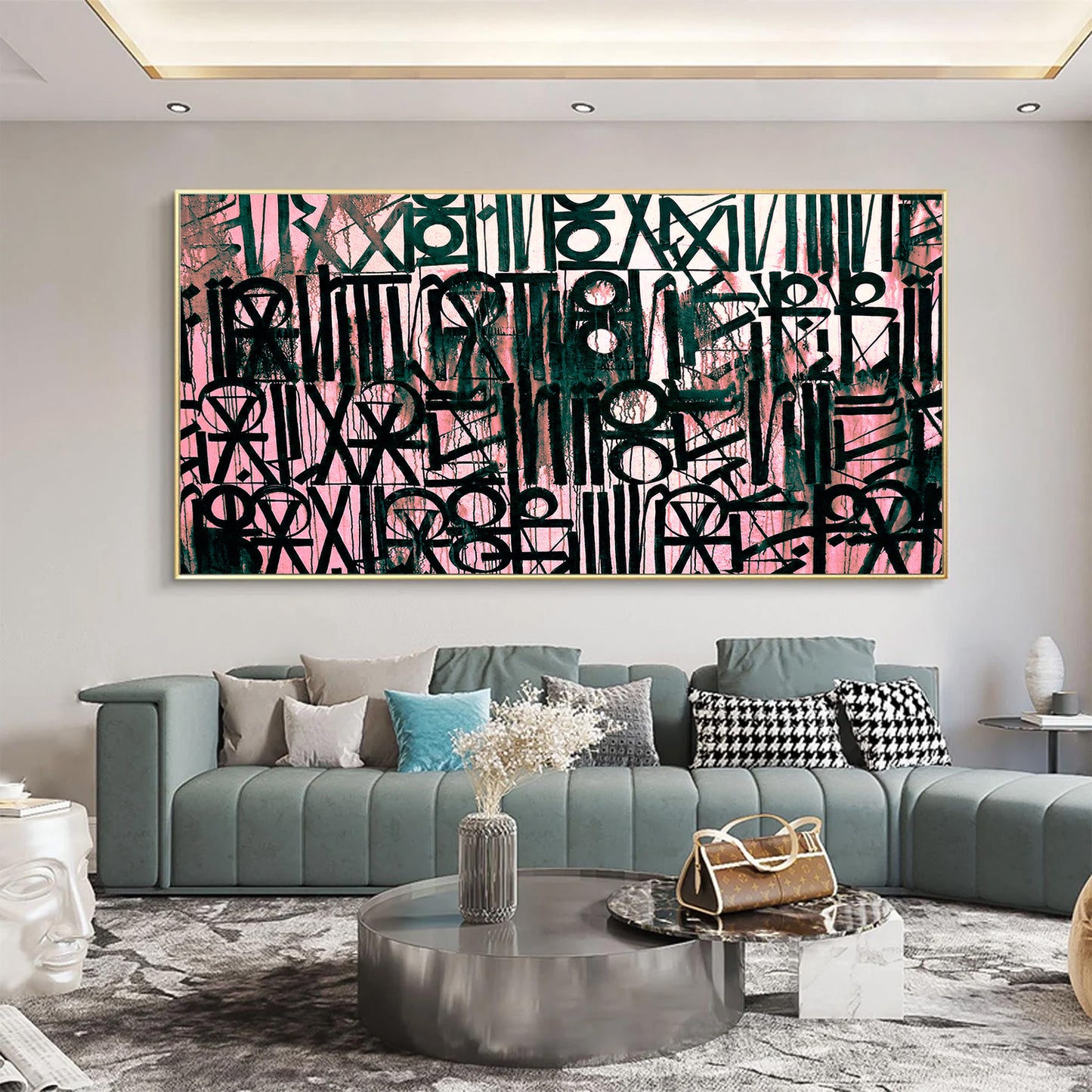 Living room with a large abstract painting on the wall, a gray sofa, and decorative items.