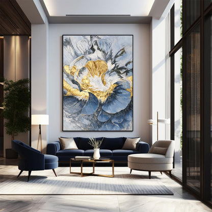 Modern living room with abstract art, navy sofa, and armchair.