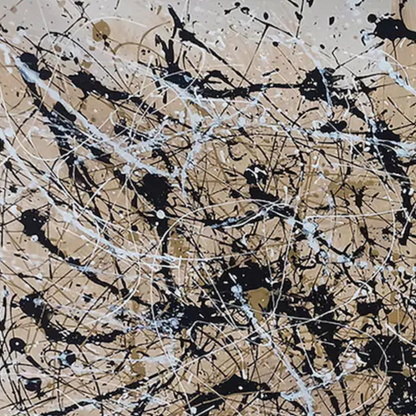 Detail of black and white splatters with fine gold accents over a warm beige ground.