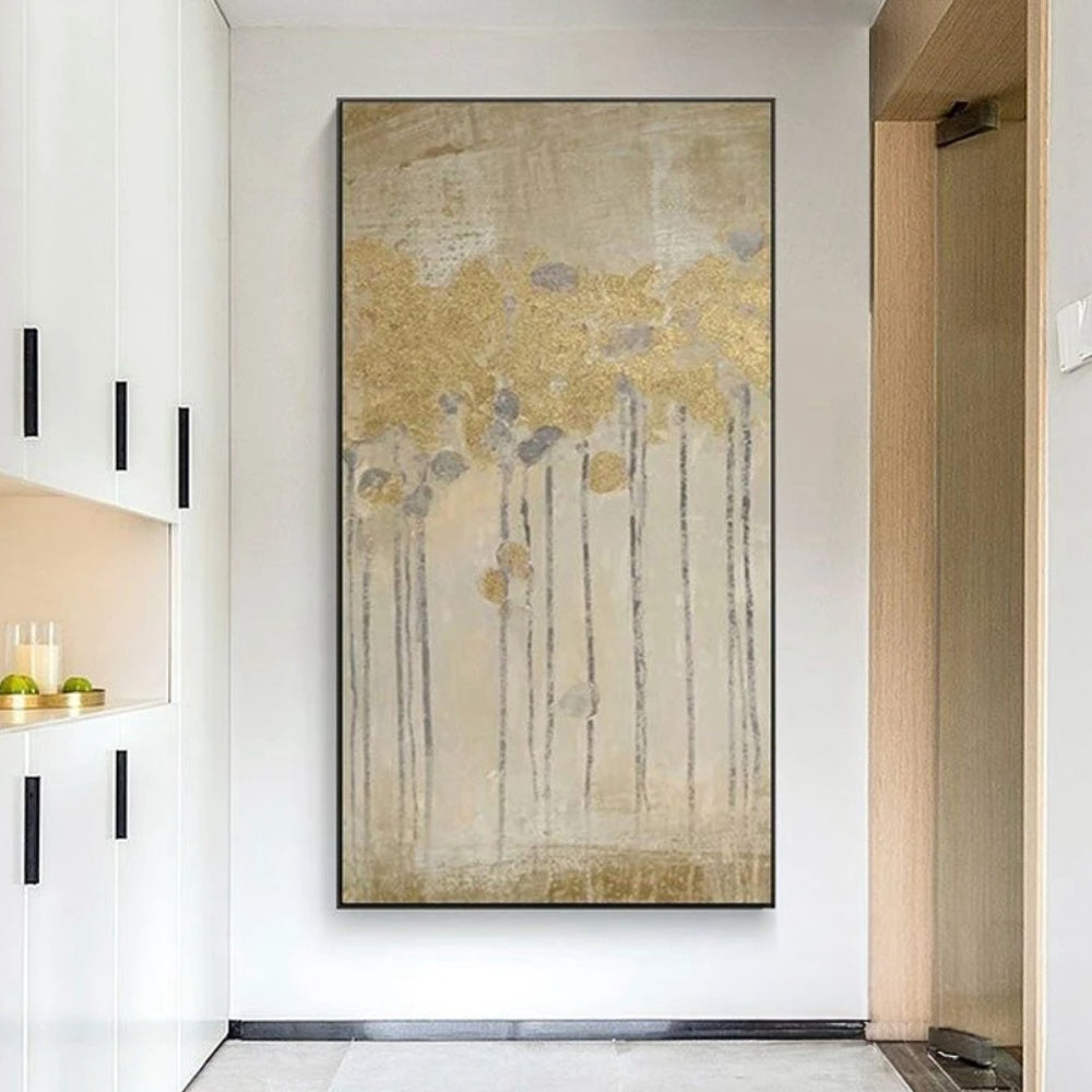 Room mockup showing gold-coloured flower heads on long thin dark stems over a softly textured beige and grey background.