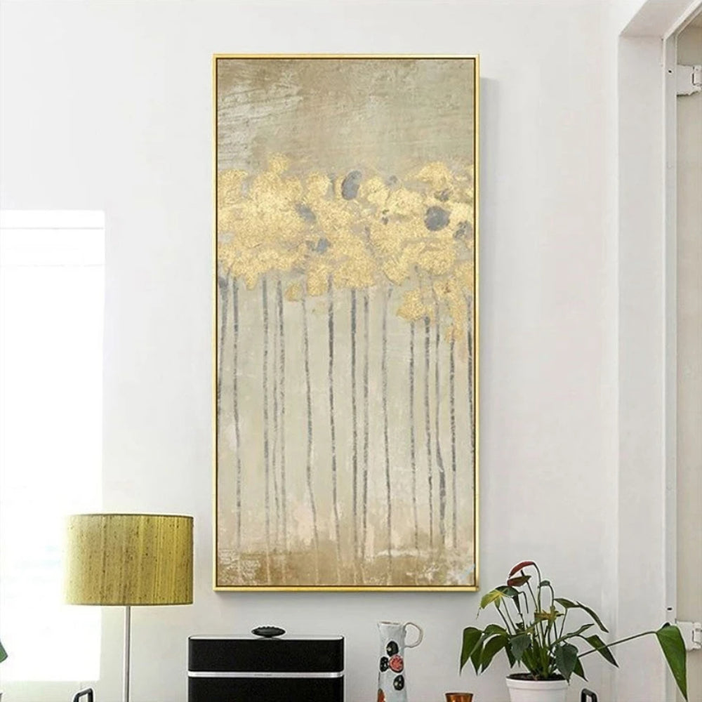 Room mockup showing gold-coloured flower heads on long thin dark stems over a softly textured beige and grey background.