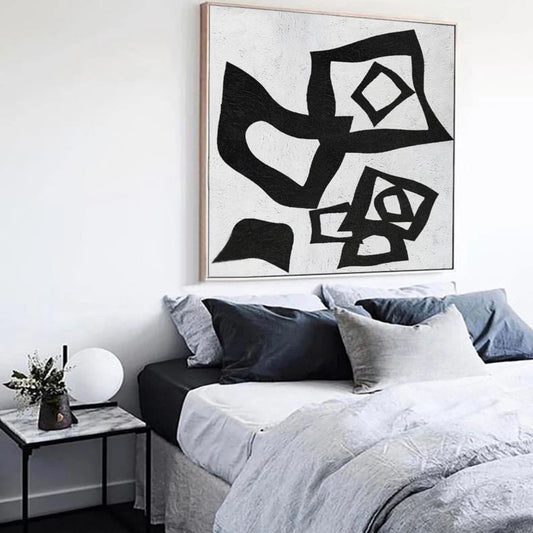 Room mockup. Overlapping black angular loops, diamond centres and curved shapes scattered on a pale textured ground.