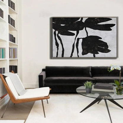 Room mockup. Large black flower silhouettes with drooping petals and thin stems on a pale grey textured background.