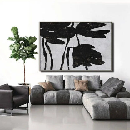 Room mockup. Large black flower silhouettes with drooping petals and thin stems on a pale grey textured background.