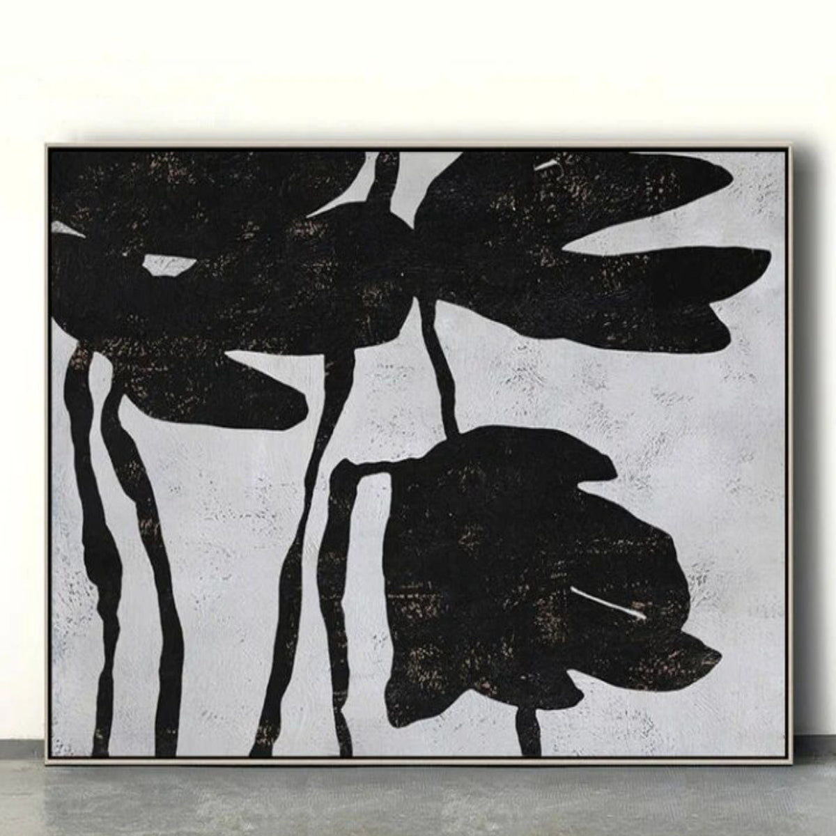 Room mockup. Large black flower silhouettes with drooping petals and thin stems on a pale grey textured background.