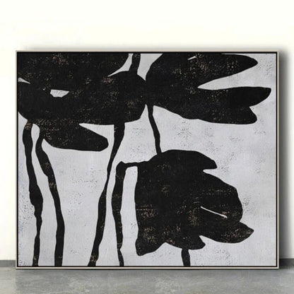Room mockup. Large black flower silhouettes with drooping petals and thin stems on a pale grey textured background.