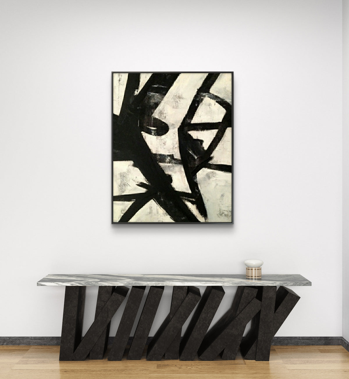 Room mockup. Bold black diagonal and looping strokes overlap a cream background with grey scuffed patches.