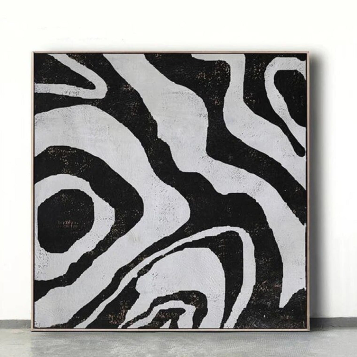 Room mockup. Broad irregular black contour-like bands flowing around pale grey shapes in an abstract composition.