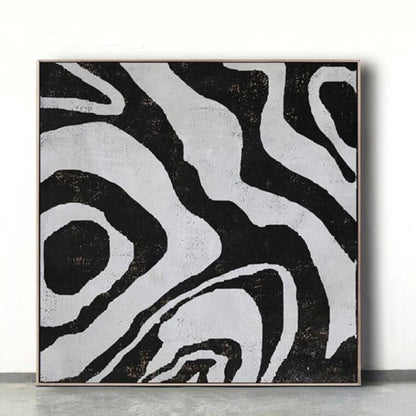 Room mockup. Broad irregular black contour-like bands flowing around pale grey shapes in an abstract composition.