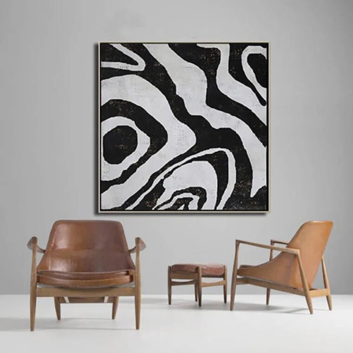 Room mockup. Broad irregular black contour-like bands flowing around pale grey shapes in an abstract composition.