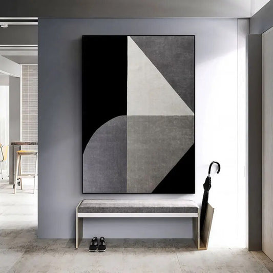 Room mockup. Black and grey geometric blocks combine a pale triangle, a quarter-circle and a dark diagonal corner.