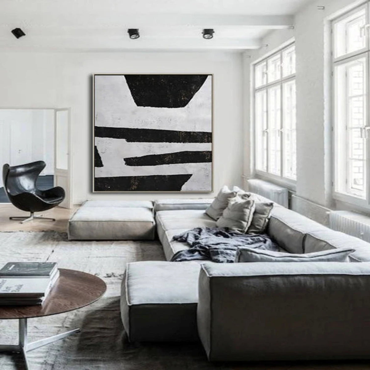 Room mockup. Uneven black horizontal strips and broad trapezoid shapes on a pale grey textured ground.