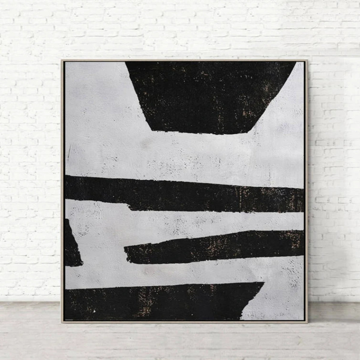 Room mockup. Uneven black horizontal strips and broad trapezoid shapes on a pale grey textured ground.