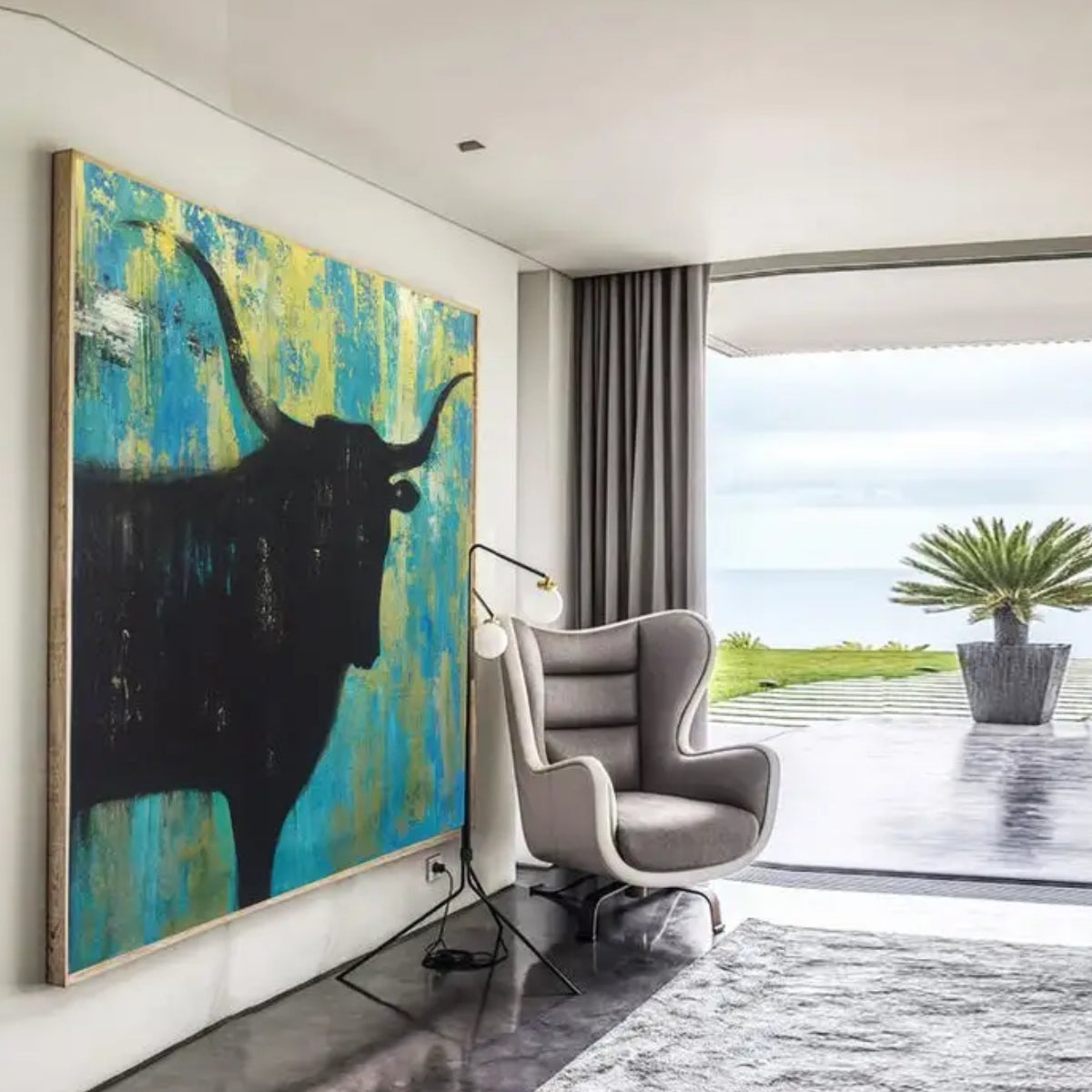 Room mockup. A black longhorn bull silhouette with wide curved horns against a rough turquoise and yellow background.