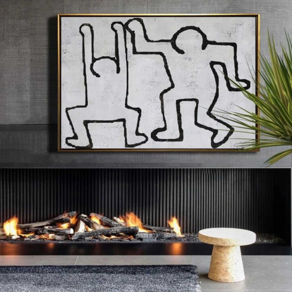 Room mockup. Two playful dancing figures drawn with continuous black outlines on a pale grey textured background.
