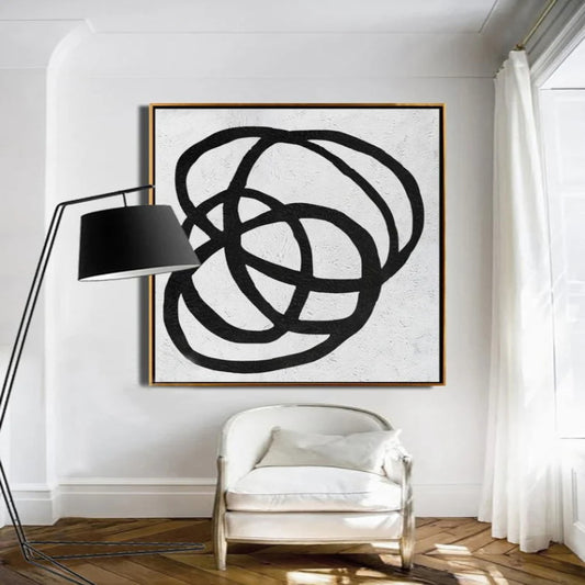 Room mockup. Thick black irregular oval loops overlap on a pale textured background.
