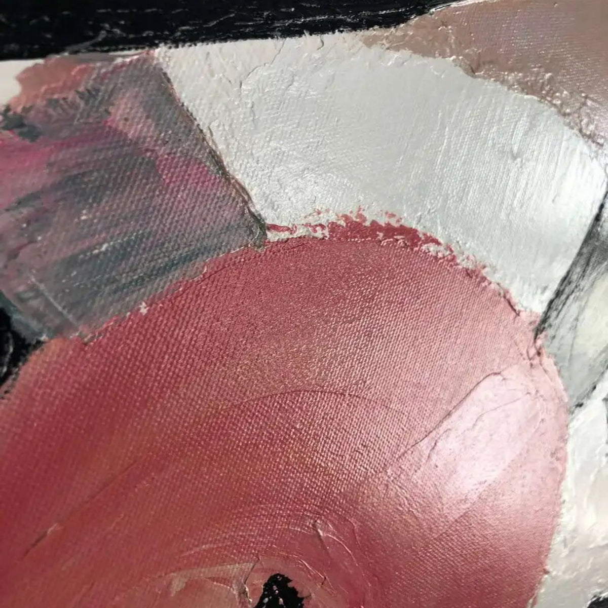Close-up. Sweeping black curves overlap pale pink, cream and coral-red rounded patches with visible brush texture.