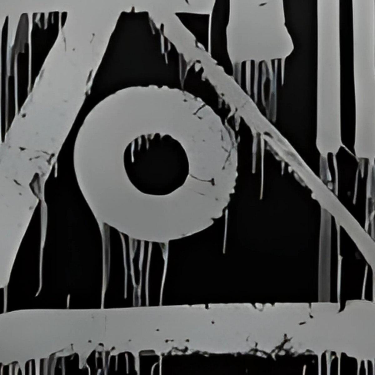 Detail of silver-grey circular and angular forms with drips against black.