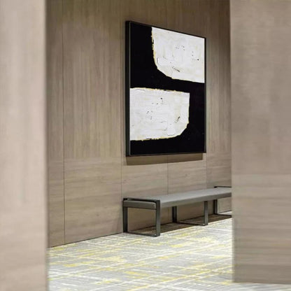 Room mockup. A broad black angular shape separates two irregular white blocks, with fine gold-coloured edges and visible texture.