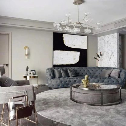 Room mockup. A broad black angular shape separates two irregular white blocks, with fine gold-coloured edges and visible texture.