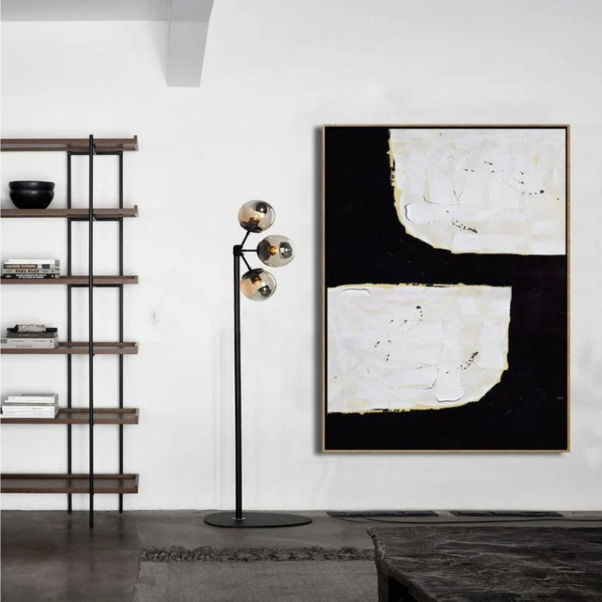 Room mockup. A broad black angular shape separates two irregular white blocks, with fine gold-coloured edges and visible texture.