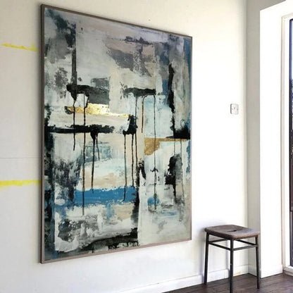Room mockup showing black vertical drips and horizontal marks over pale grey-white fields with a blue band and small gold-coloured accents.