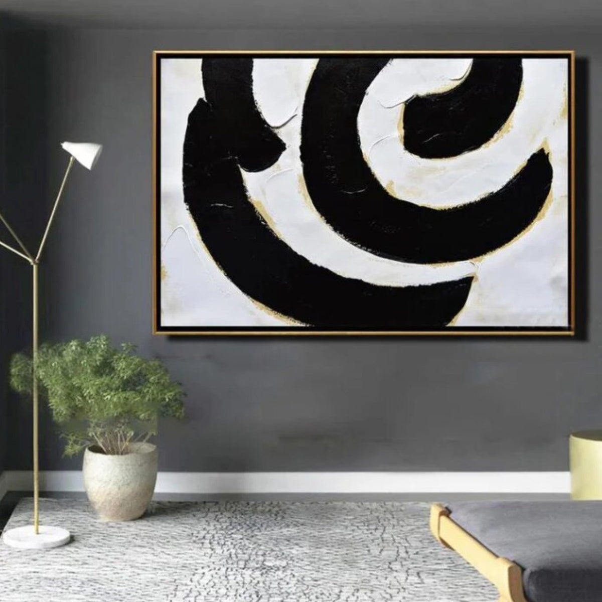 Room mockup. Broad black and white curved bands with fine gold-coloured edges forming an off-centre swirling composition.