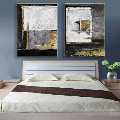 Room mockup showing two textured abstract panels with black, white and grey geometric fields and gold-coloured accents.