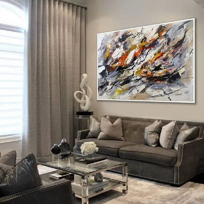 Room mockup showing sweeping black, white and grey expressive marks with orange, yellow and muted purple accents.