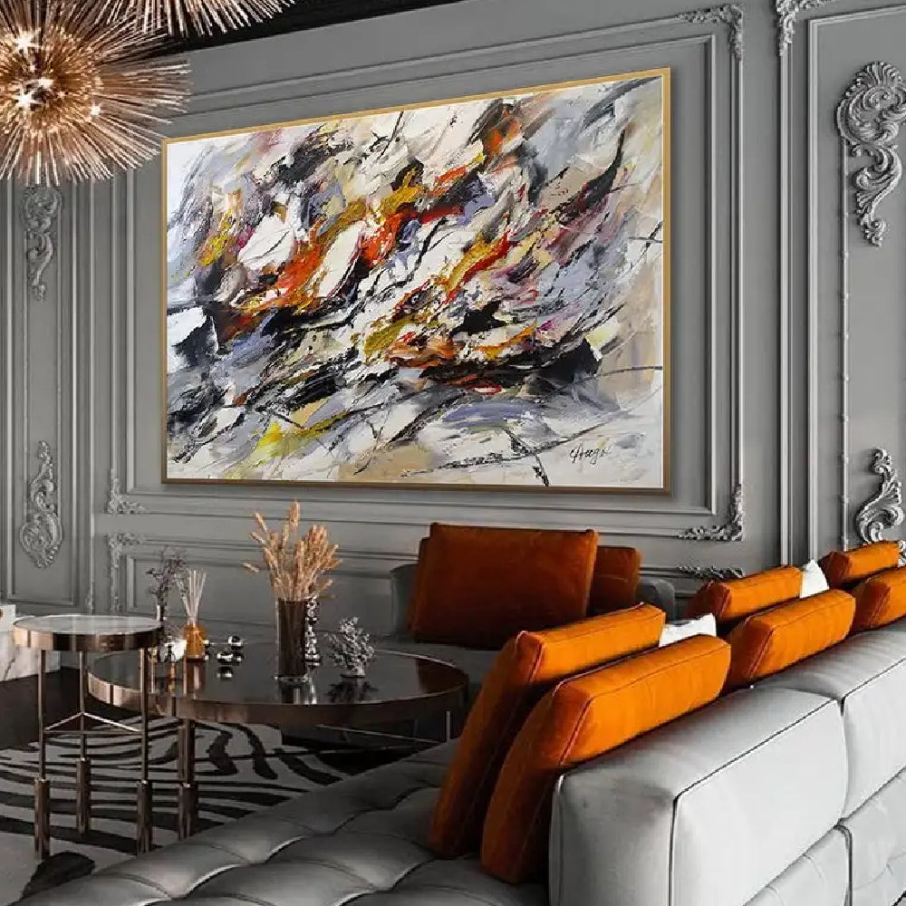 Room mockup showing sweeping black, white and grey expressive marks with orange, yellow and muted purple accents.
