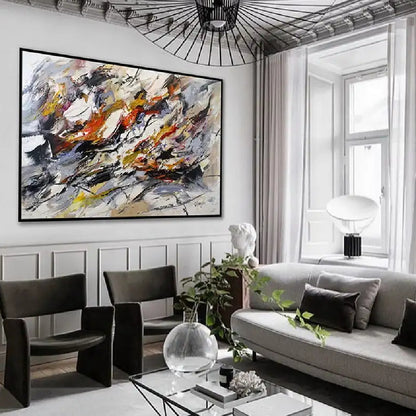 Room mockup showing sweeping black, white and grey expressive marks with orange, yellow and muted purple accents.