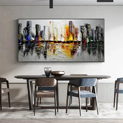 Room mockup showing black and white city towers with yellow, orange and small blue accents reflected across a grey foreground.