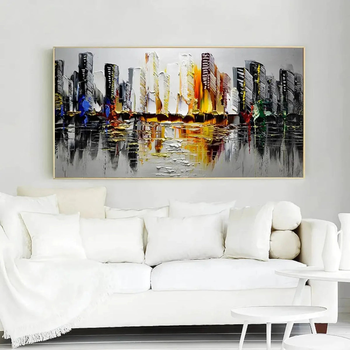 Room mockup showing black and white city towers with yellow, orange and small blue accents reflected across a grey foreground.