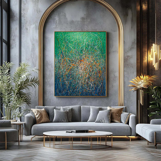 Green and teal abstract expressionist wall art mounted above a white sofa in a contemporary living room.