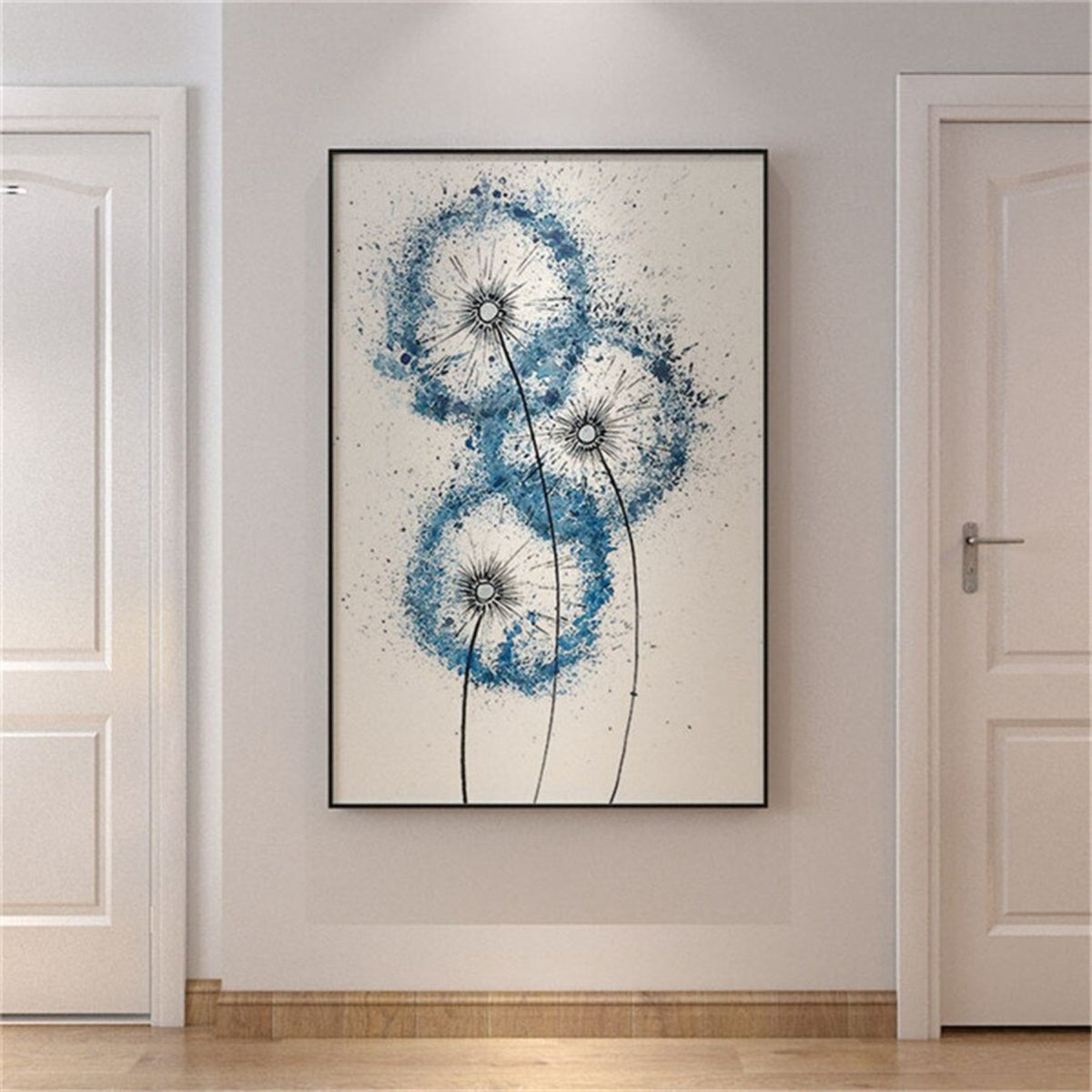 Room mockup. Three blue dandelion-like seed heads on fine dark stems, with scattered blue speckles against pale cream.