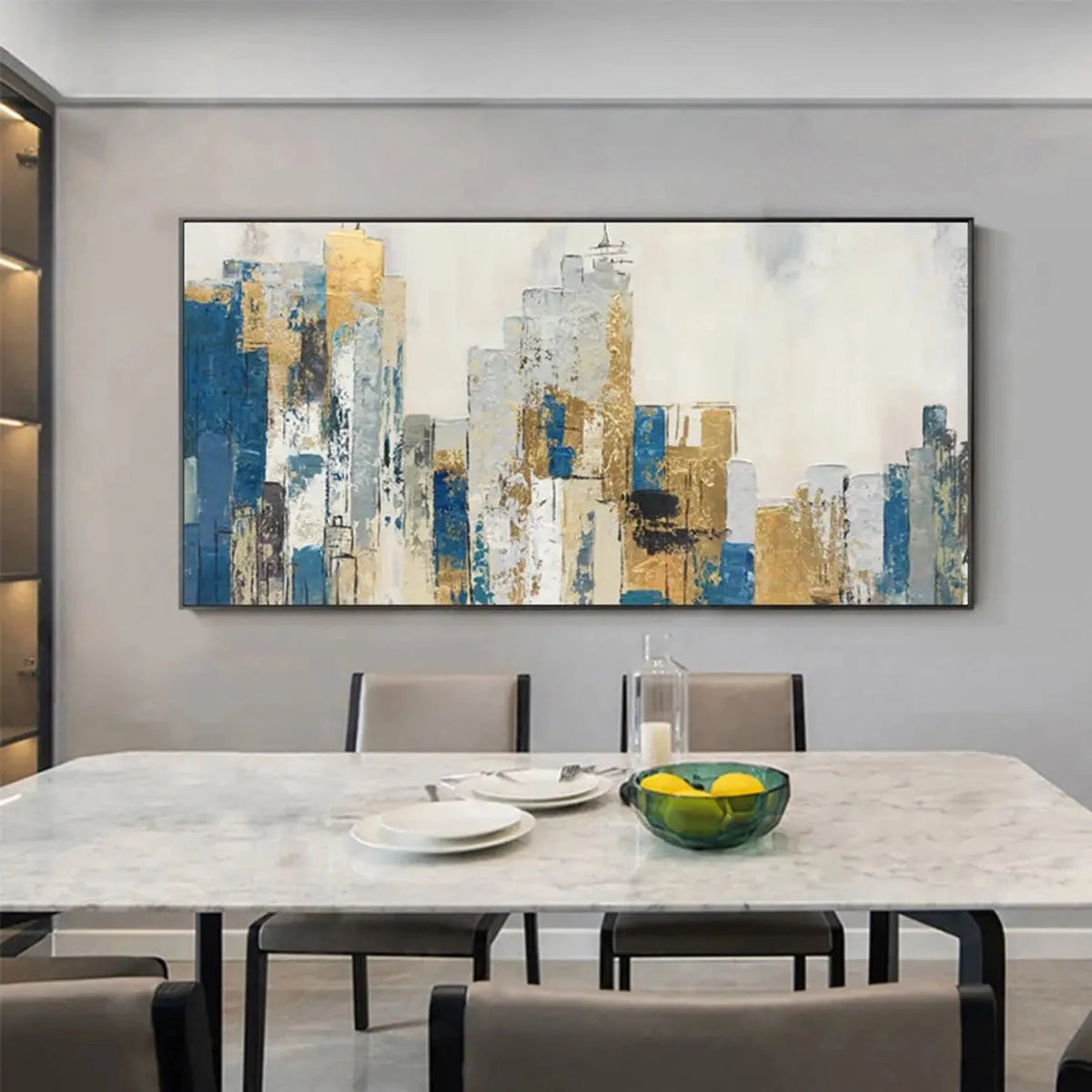 Room mockup showing abstract city buildings in blue, grey, cream and gold-coloured blocks beneath a pale sky.