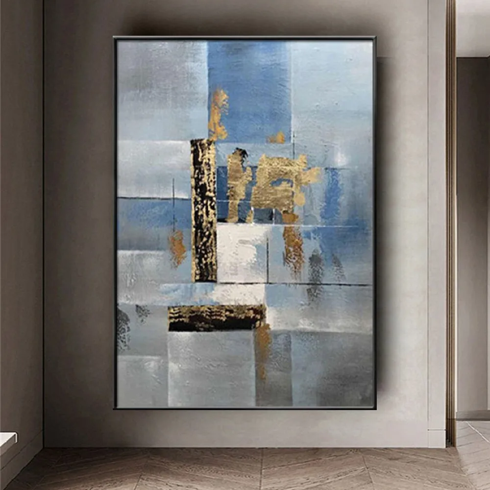 Room mockup showing abstract architectural blocks in muted blue and grey with gold-coloured patches and thin horizontal lines.