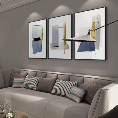 Room mockup showing three minimalist white panels with blue-grey geometric shapes, narrow gold-coloured strips and fine black lines.