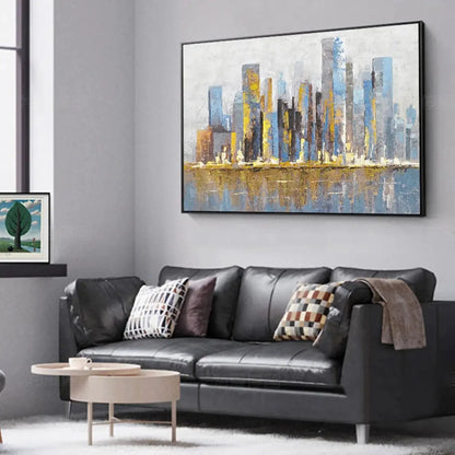 Room mockup showing slender blue and grey city towers with gold-coloured accents reflected in a pale blue foreground.