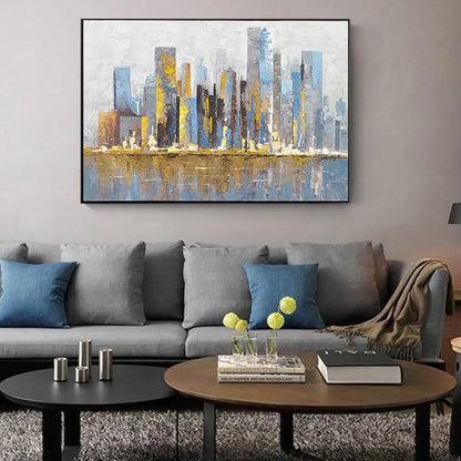 Room mockup showing slender blue and grey city towers with gold-coloured accents reflected in a pale blue foreground.