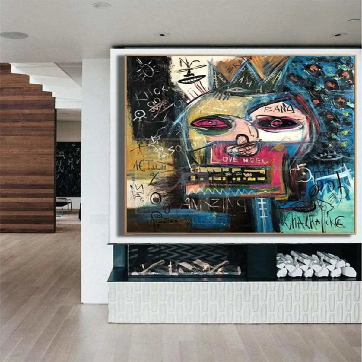 Room mockup showing crowned abstract face in blue, pink, yellow and black surrounded by scribbles and symbols.